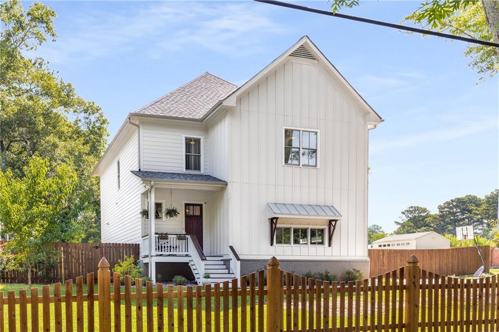 1653 Hudson Road Decatur, GA 30033 - Photo 1 of 1 a front view of a house with glass windows and a tree