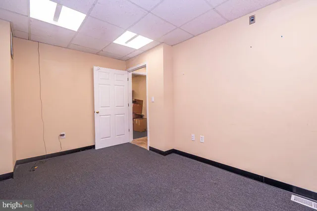 a storage room with cabinets and wooden floor