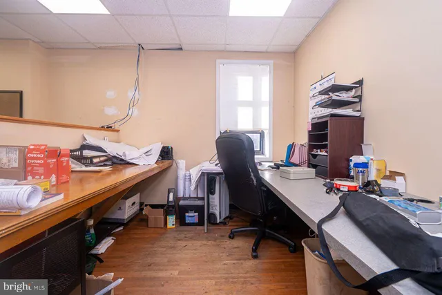 an empty room with workspace and window