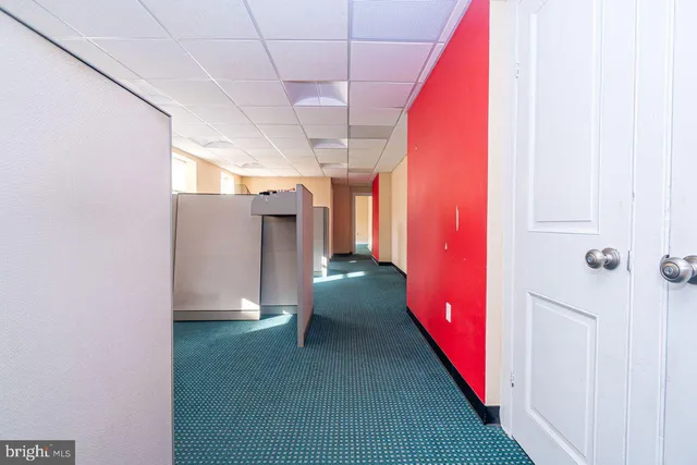 a bathroom with a sink toilet and window