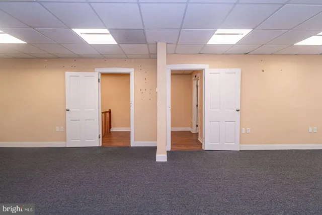 a view of hallway with wooden floor
