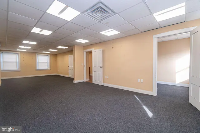 a view of living room with furniture and a window