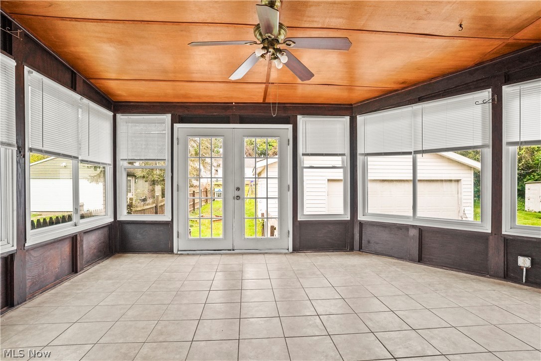 688 Ranney Street Akron, OH 44310 - Photo 18 of 35 Unfurnished sunroom featuring wooden ceiling, ceiling fan, and french doors