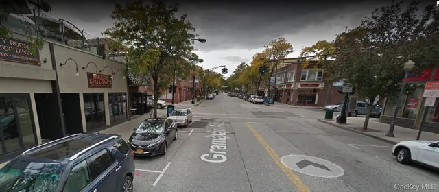 a view of a street with cars