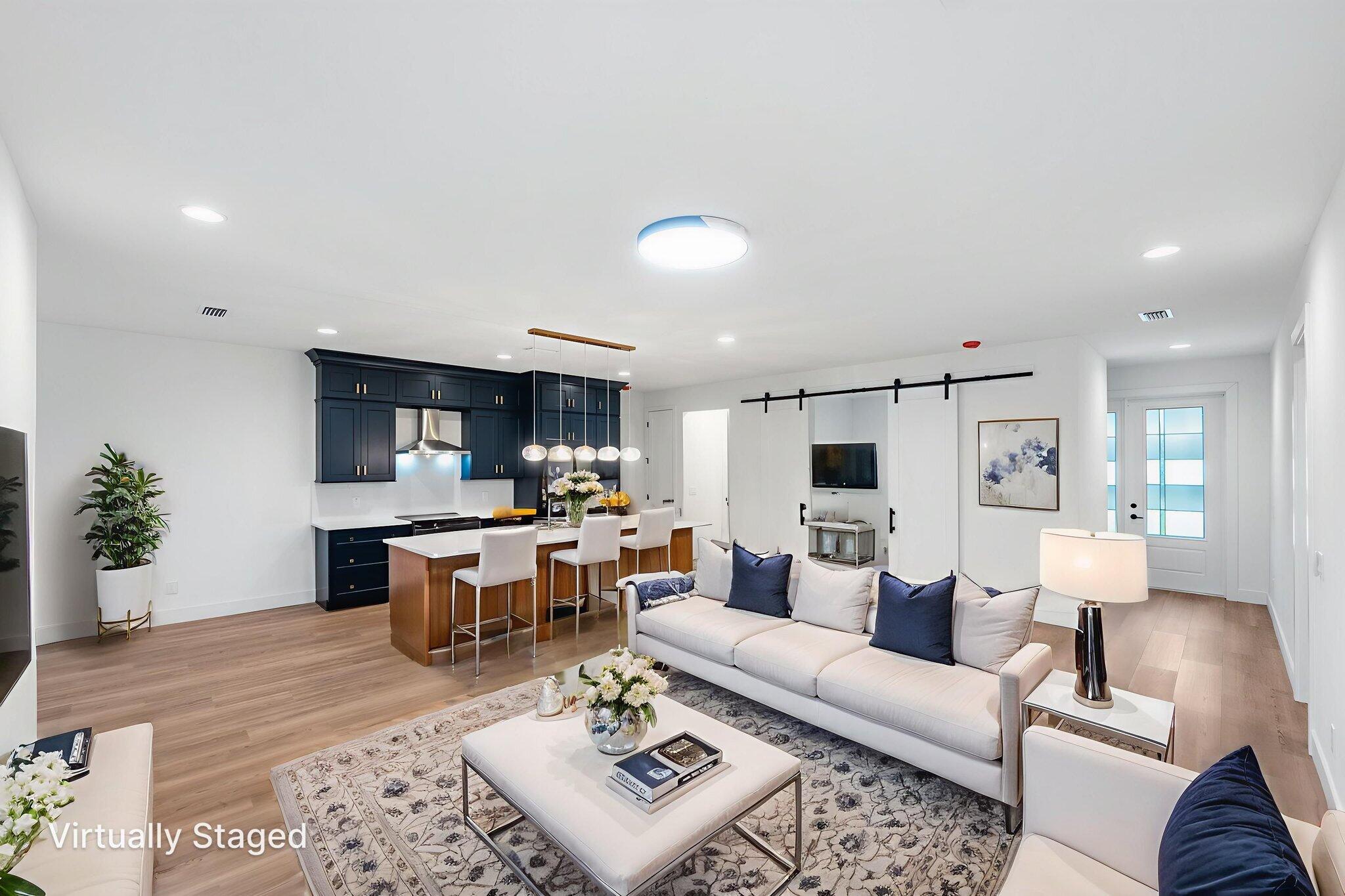 3113 Nighthawk Avenue Palm Bay, FL 32908 - Photo 15 of 33 a living room with furniture a rug kitchen view and a table