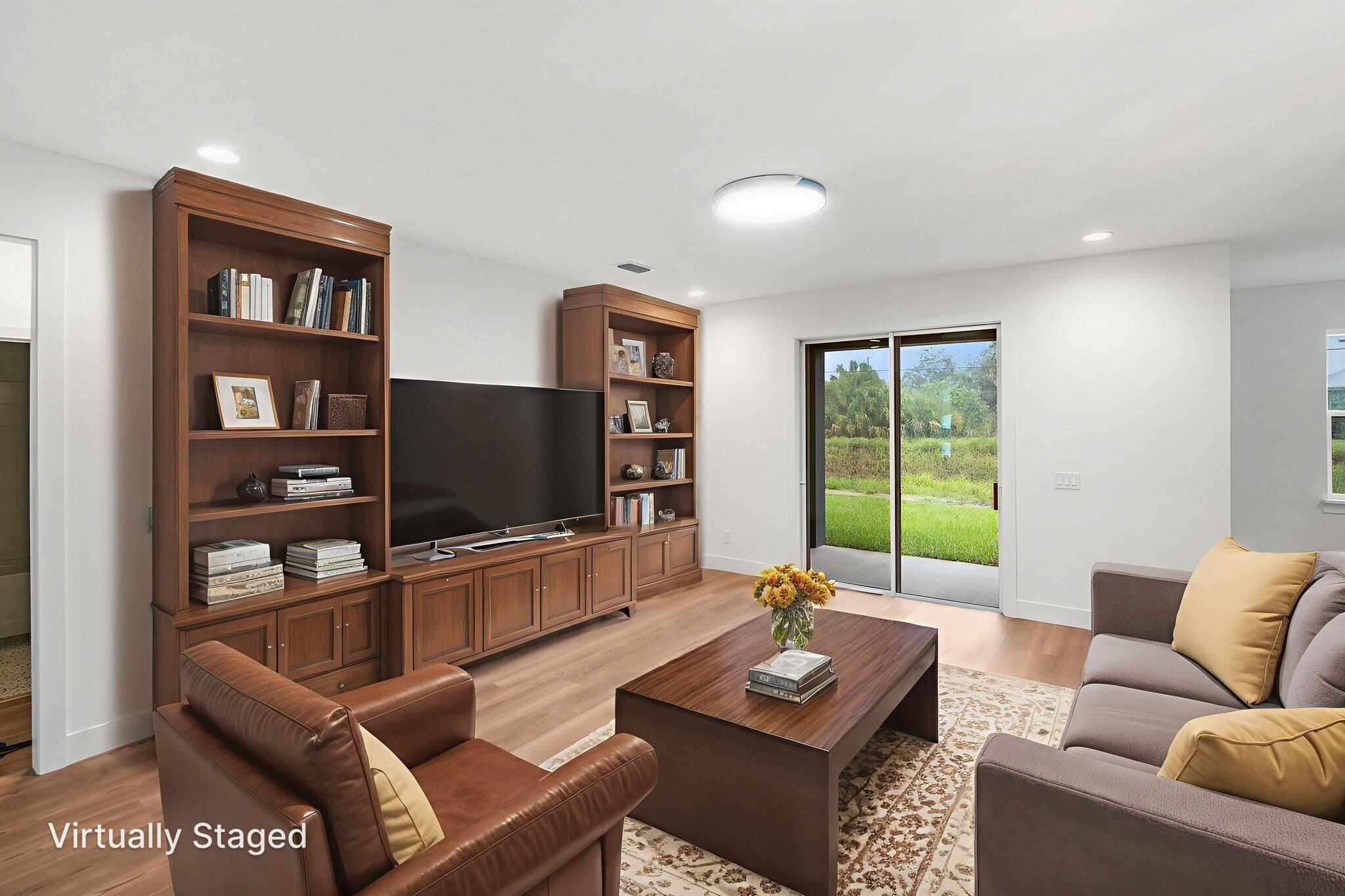 3113 Nighthawk Avenue Palm Bay, FL 32908 - Photo 17 of 33 a living room with furniture and a flat screen tv