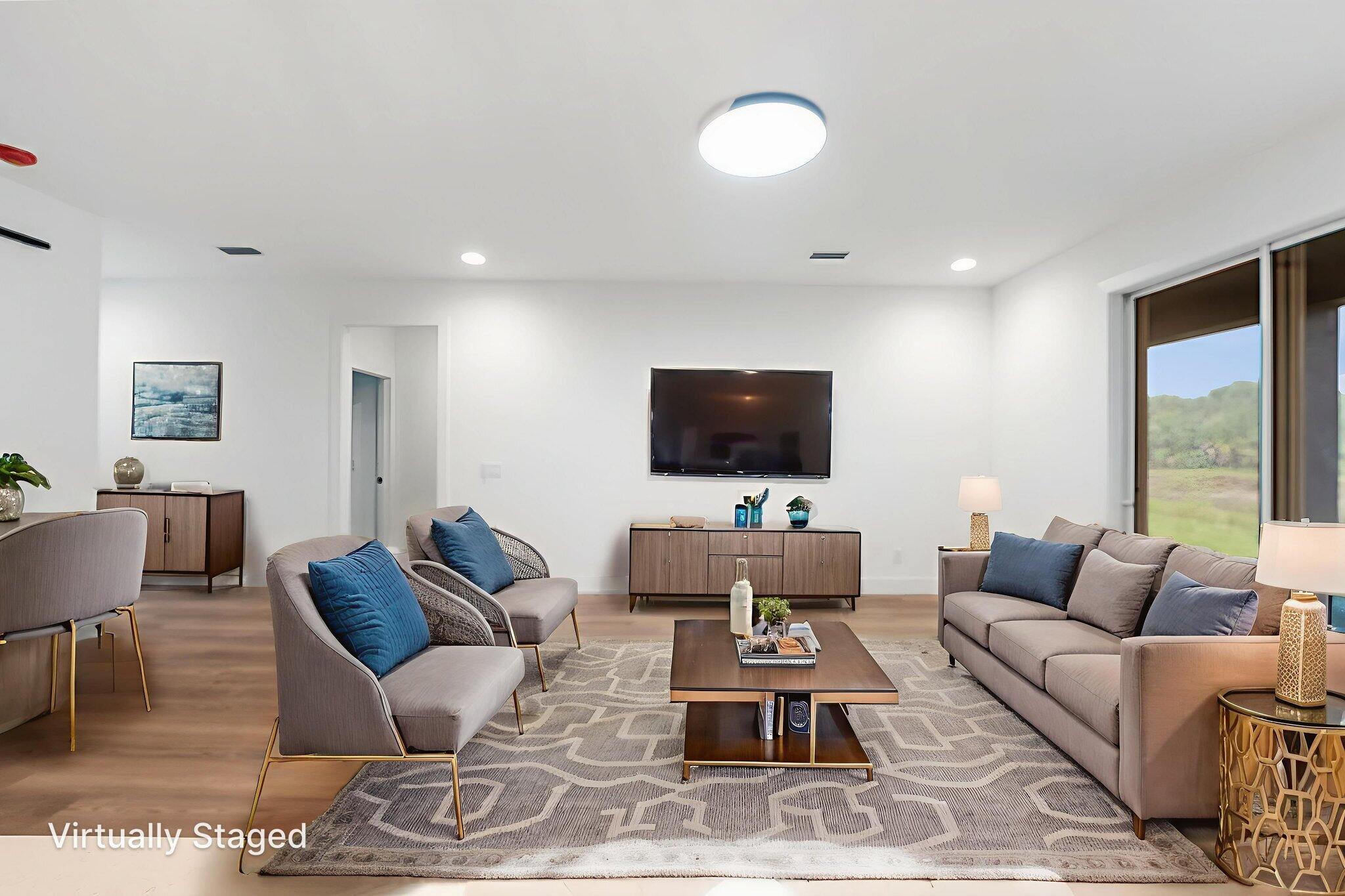 3113 Nighthawk Avenue Palm Bay, FL 32908 - Photo 19 of 33 a living room with furniture a rug and a flat screen tv