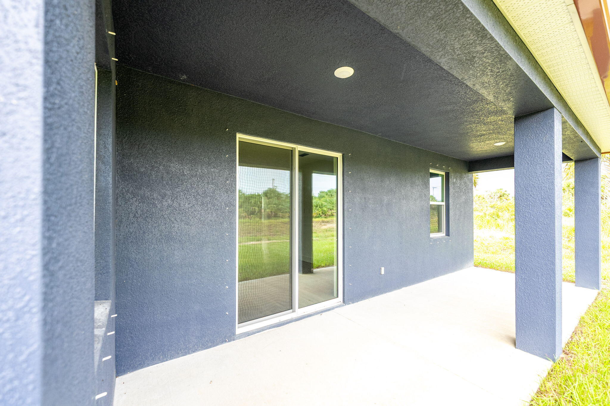 3113 Nighthawk Avenue Palm Bay, FL 32908 - Photo 29 of 33 a bedroom with a bed and large window