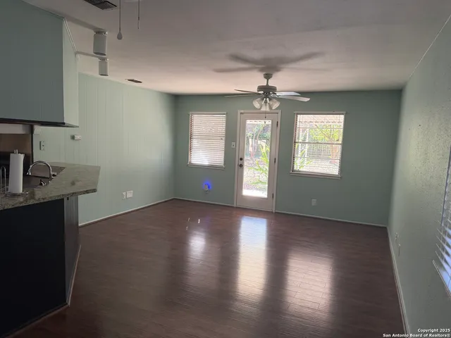 a backyard of a house with lots of green space