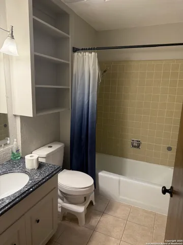 a view of a big room with a fan