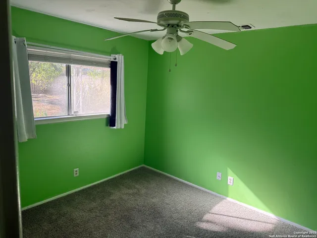 a bathroom with a sink vanity mirror and toilet