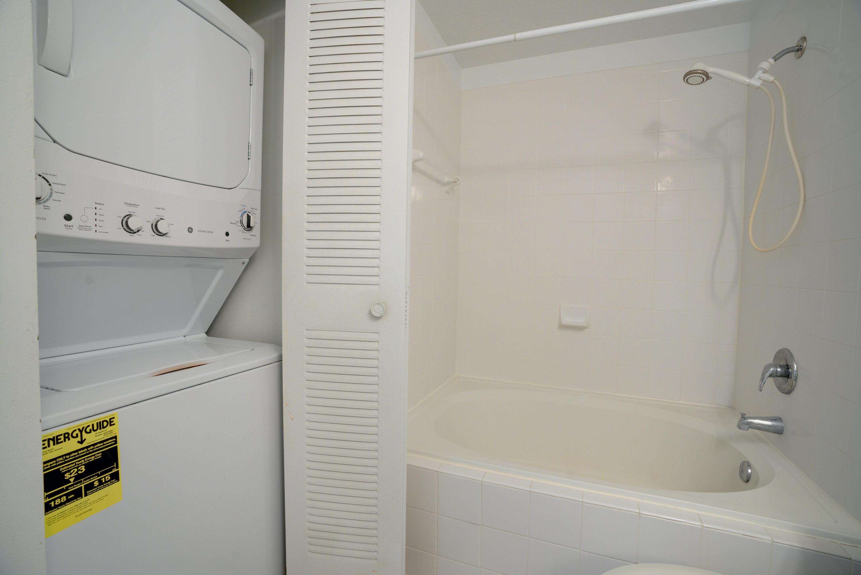 1136 Town Center Drive, Unit 11 Jupiter, FL 33458 - Photo 21 of 24 a bathroom with a bathtub and a shower