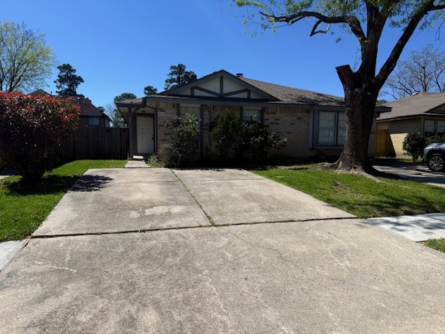 a front view of a house with a yard and a garage