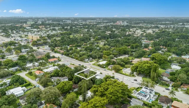 an aerial view of residential houses with city view and lake view