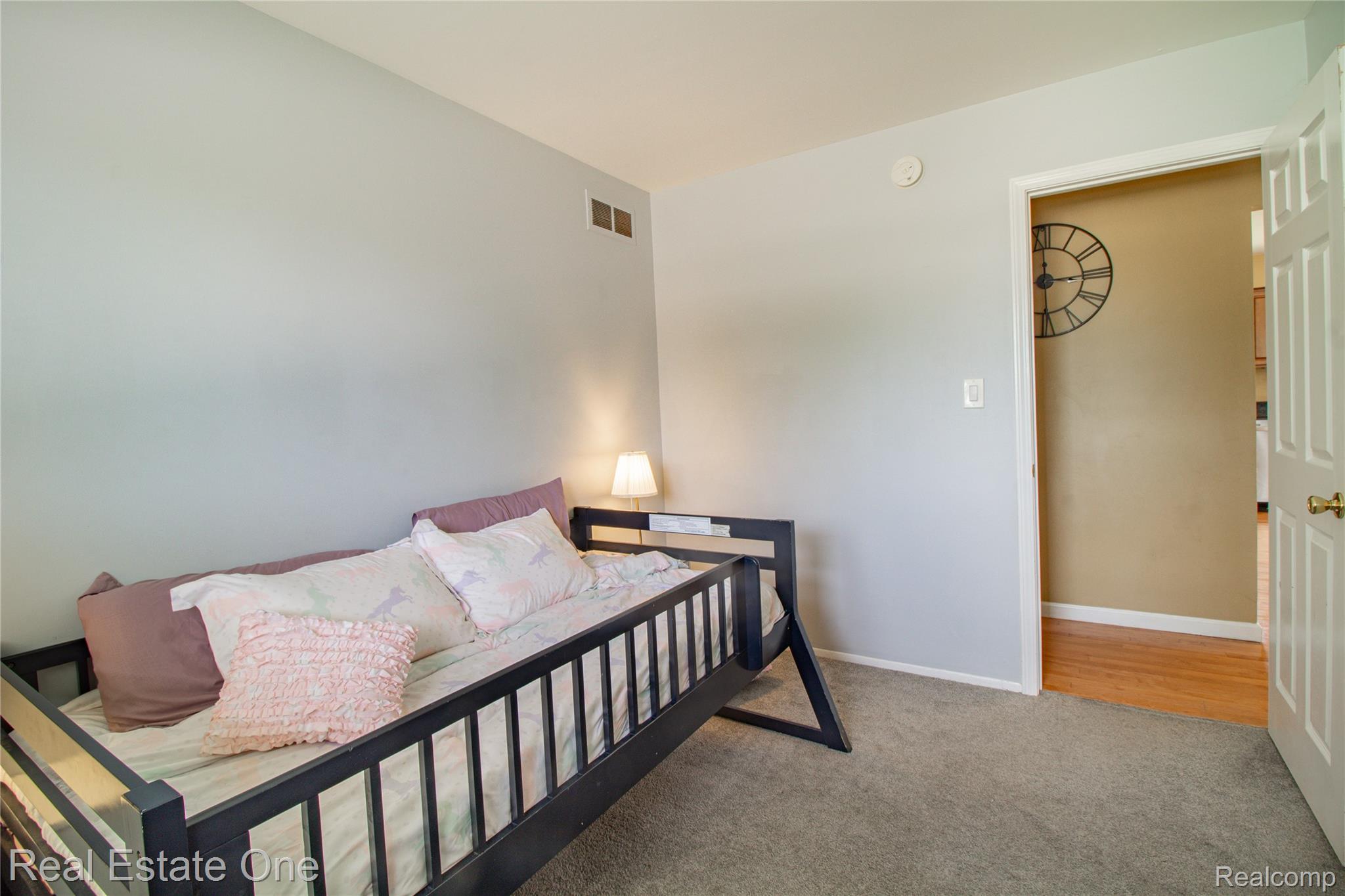 44220 Saltz Road Canton, MI 48187 - Photo 11 of 31 Neutral tone wall finish with a carpeted floor, white trim, and a white interior door