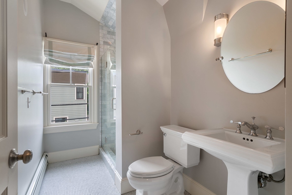 23 Bellis Circle Cambridge, MA 02140 - Photo 14 of 24 a bathroom with a sink a toilet and shower