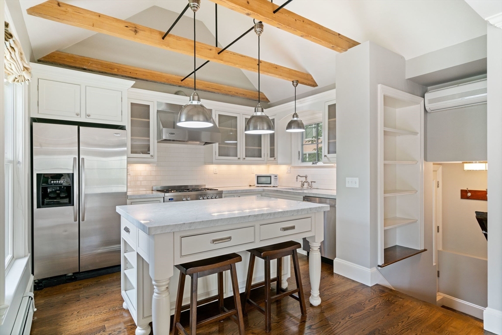 23 Bellis Circle Cambridge, MA 02140 - Photo 4 of 24 a kitchen with a stove a refrigerator and cabinets
