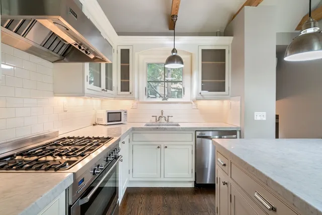 a kitchen with a stove and a sink