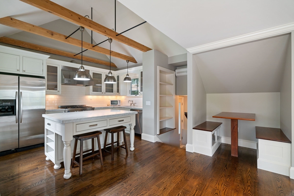 23 Bellis Circle Cambridge, MA 02140 - Photo 6 of 24 a kitchen with stainless steel appliances granite countertop a stove and a refrigerator