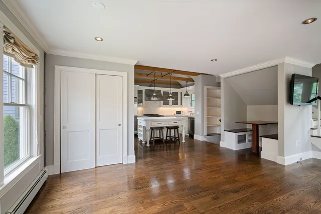 a view of kitchen with furniture and wooden floor
