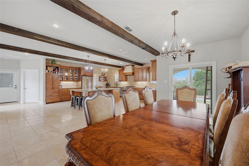 1959 Marlow Road Bells, TX 75414 - Photo 11 of 32 a living room with furniture a chandelier and a dining table