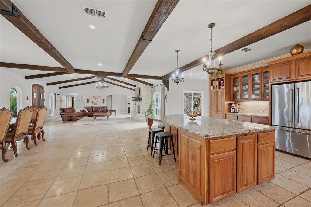 1959 Marlow Road Bells, TX 75414 - Photo 32 of 32 a view of a kitchen with furniture and a refrigerator