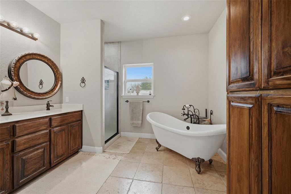 1959 Marlow Road Bells, TX 75414 - Photo 18 of 33 a bathroom with a sink and a mirror