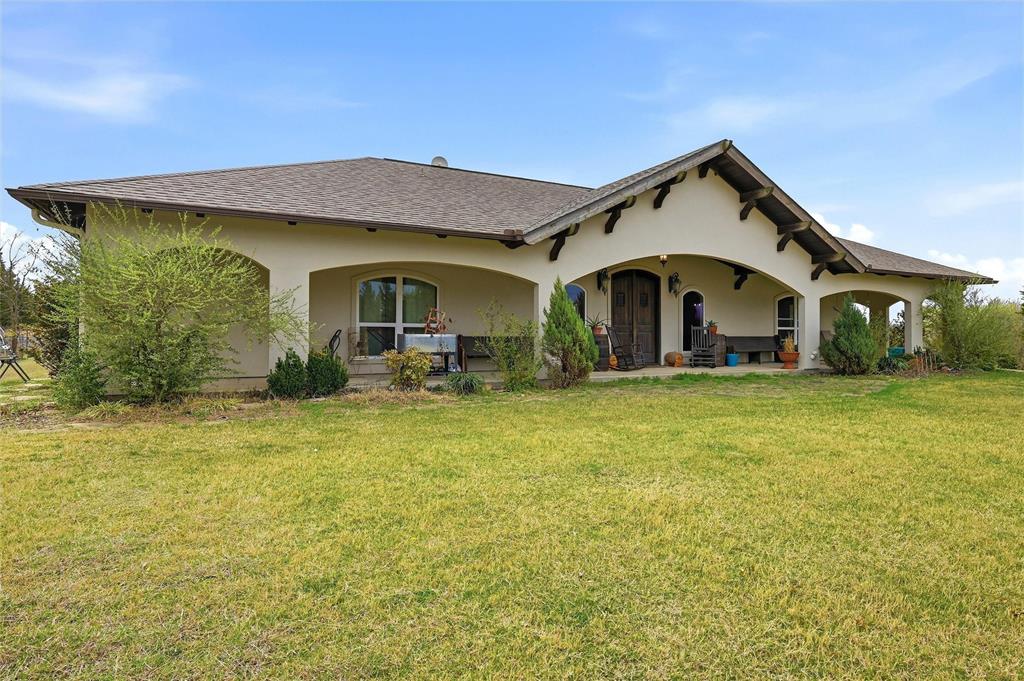 1959 Marlow Road Bells, TX 75414 - Photo 2 of 32 a front view of a house with garden