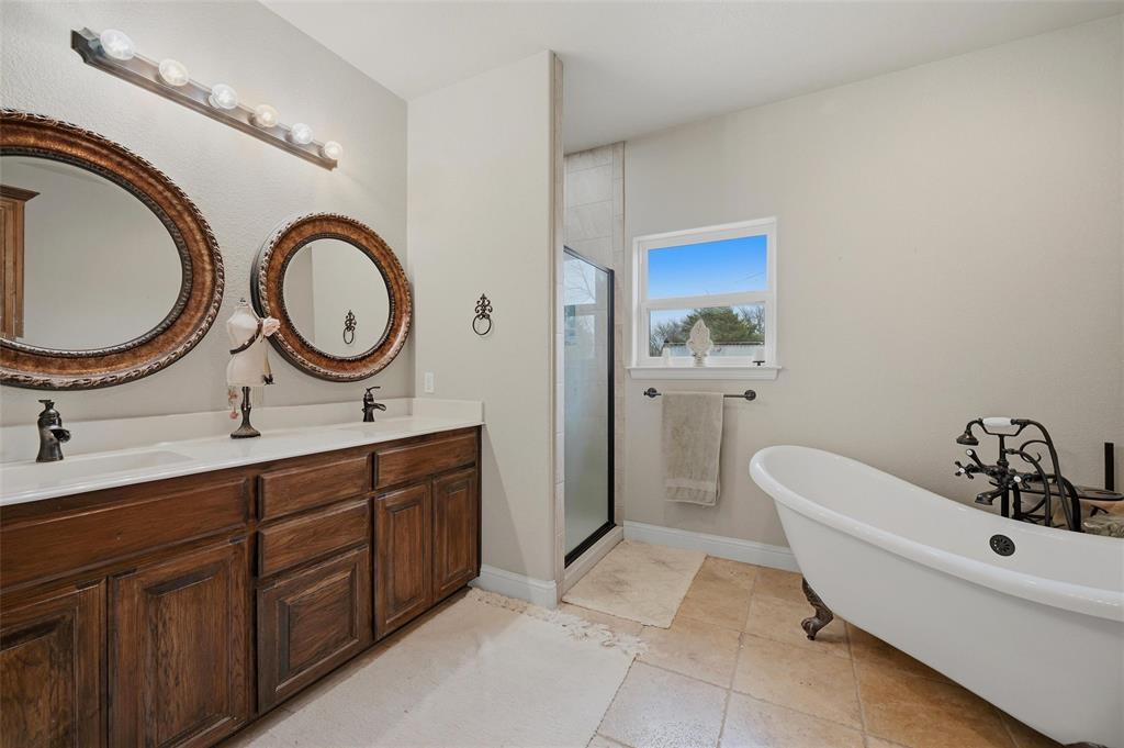 1959 Marlow Road Bells, TX 75414 - Photo 21 of 32 a spacious bathroom with a double vanity sink and a mirror