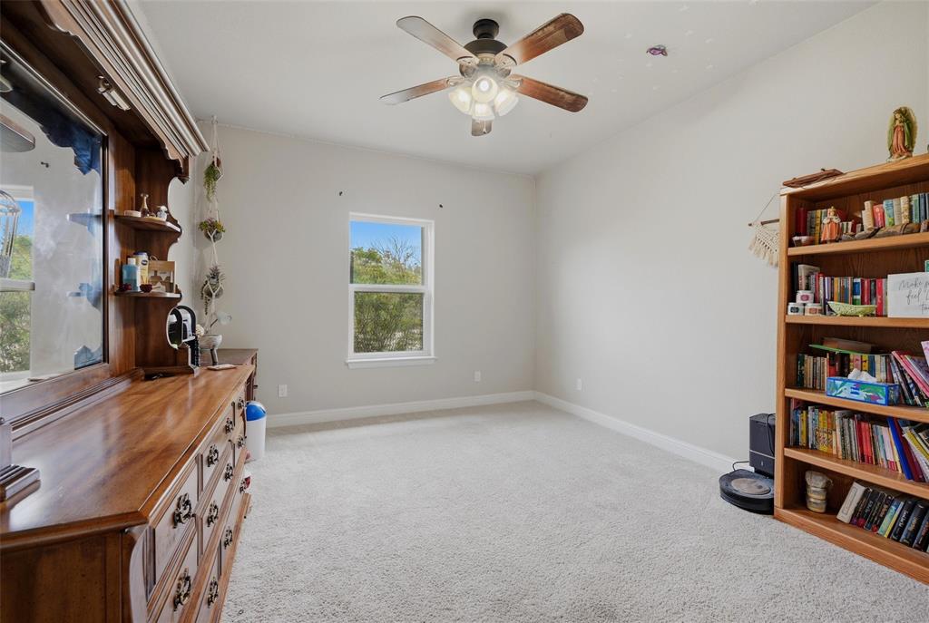 1959 Marlow Road Bells, TX 75414 - Photo 23 of 32 a view of room with window and book shelf