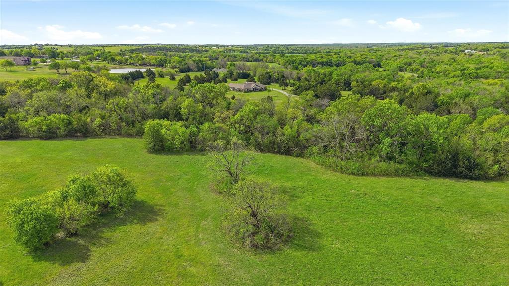 1959 Marlow Road Bells, TX 75414 - Photo 28 of 33 a view of a green field with lots of trees