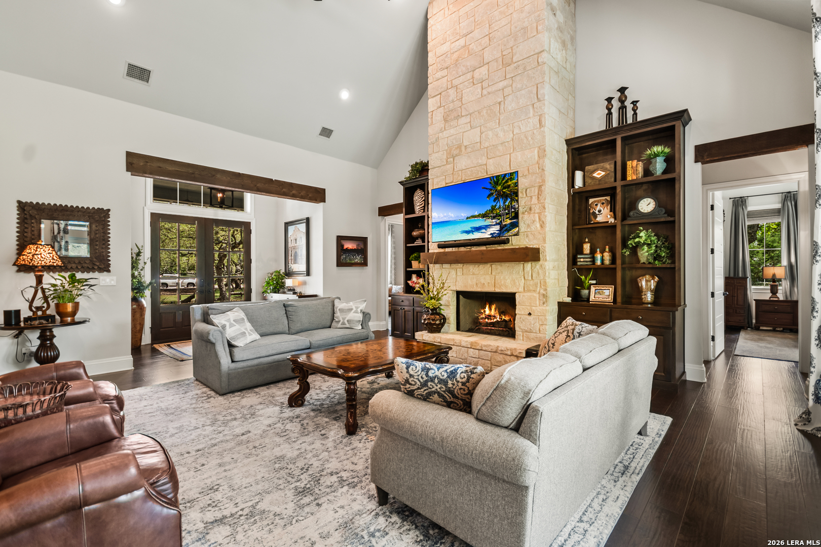 55 Brook Ridge Boerne, TX 78015 - Photo 20 of 59 a living room with furniture large window and a fireplace