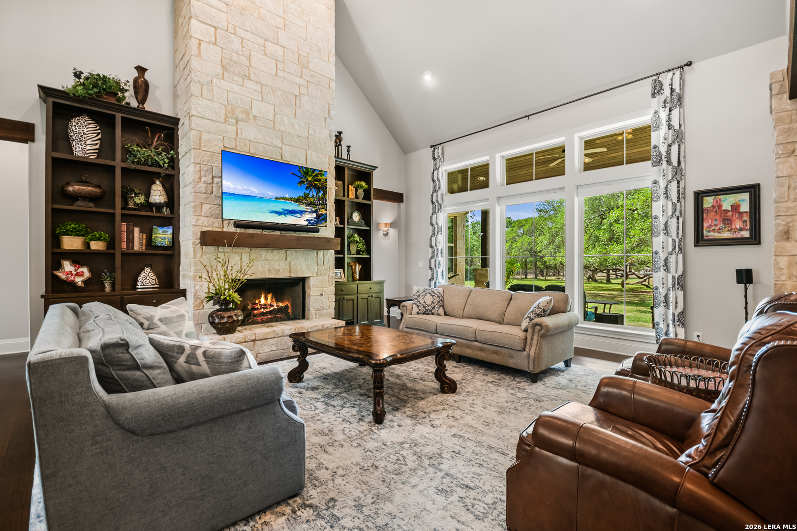 55 Brook Ridge Boerne, TX 78015 - Photo 22 of 59 a living room with furniture a flat screen tv and a fireplace