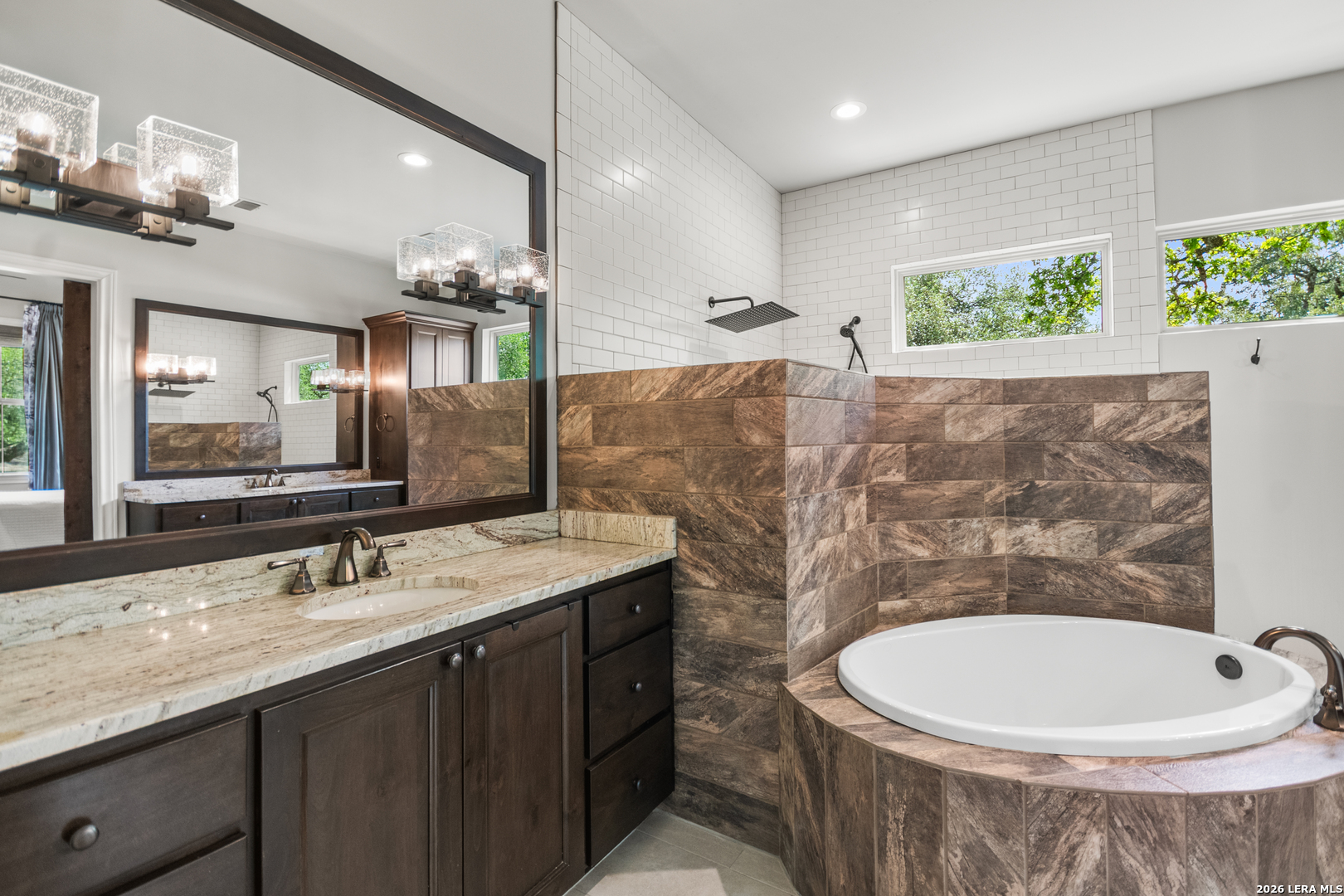 55 Brook Ridge Boerne, TX 78015 - Photo 29 of 59 a bathroom with a sink a toilet and mirror