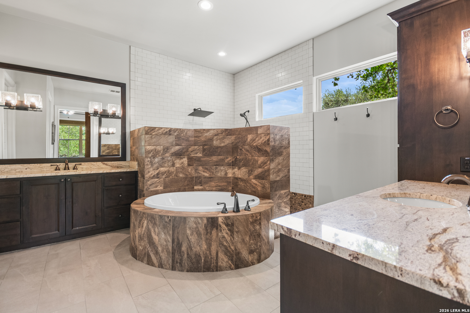 55 Brook Ridge Boerne, TX 78015 - Photo 32 of 59 a spacious bathroom with a tub sink and mirror