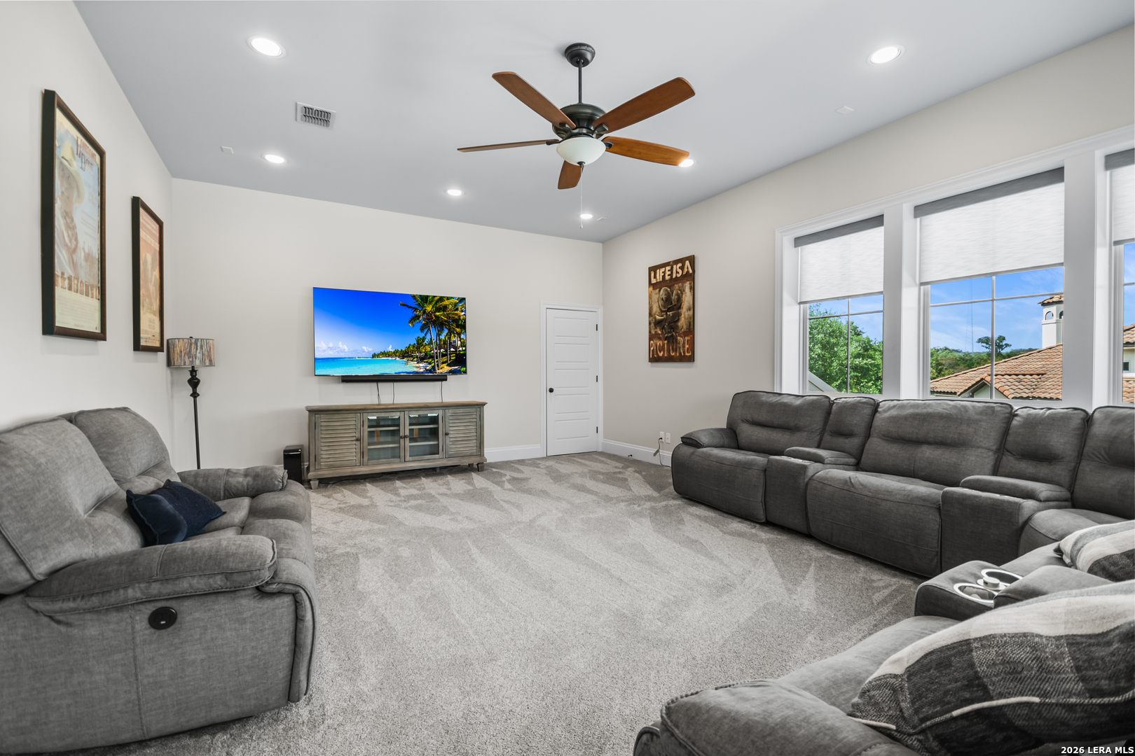 55 Brook Ridge Boerne, TX 78015 - Photo 42 of 59 a living room with furniture and a flat screen tv with kitchen view