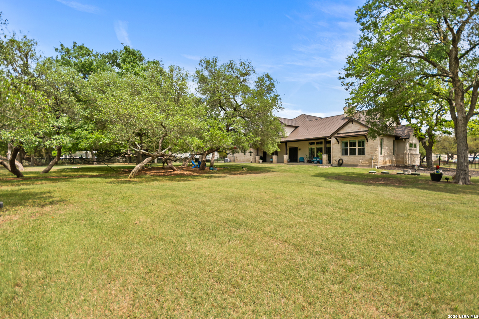 55 Brook Ridge Boerne, TX 78015 - Photo 54 of 59 a front view of a building with a garden