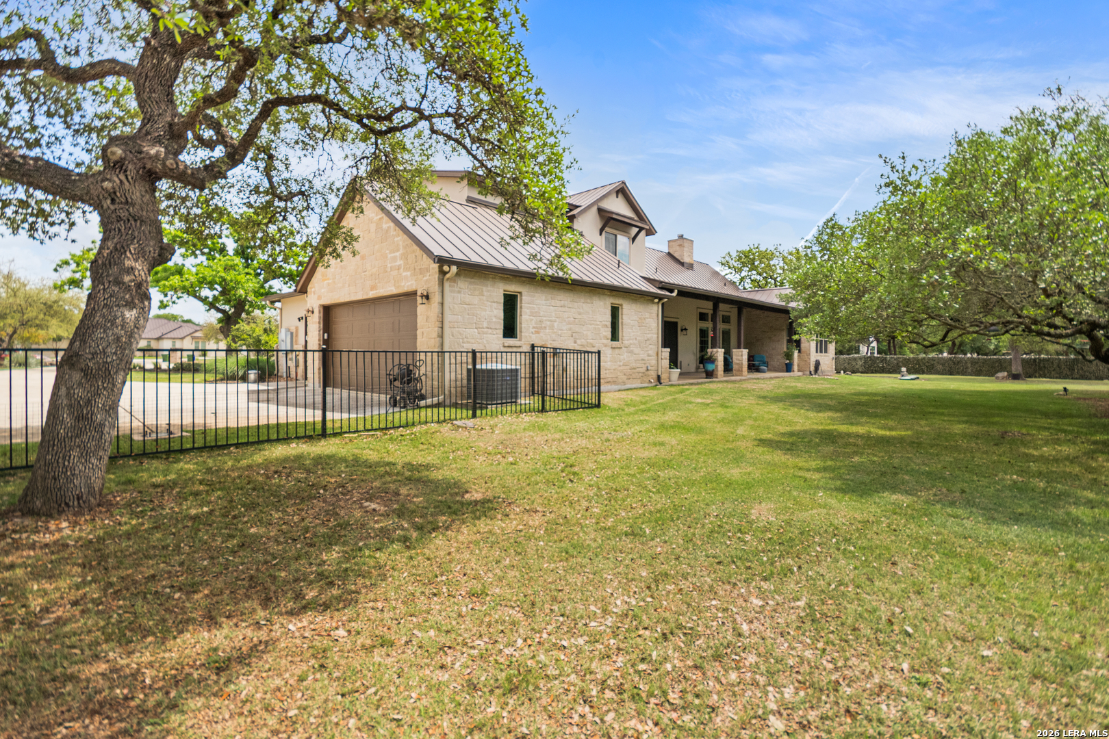 55 Brook Ridge Boerne, TX 78015 - Photo 55 of 59 a front view of house with yard and green space