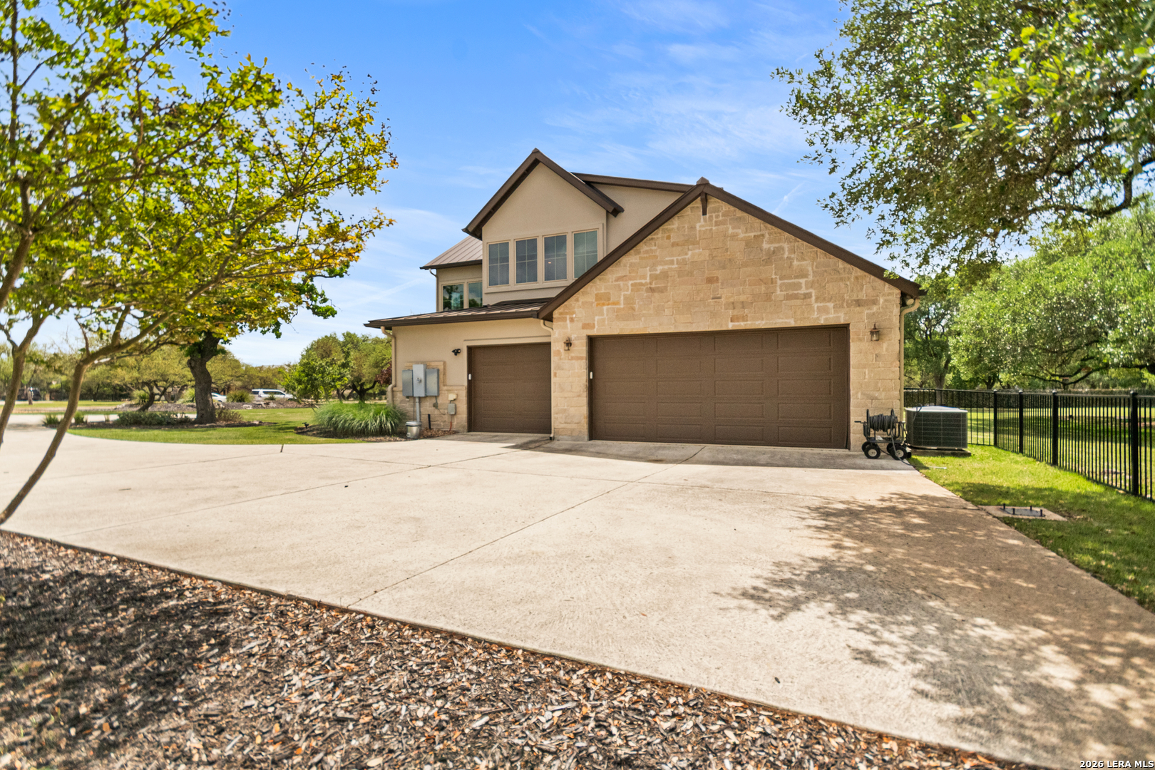 55 Brook Ridge Boerne, TX 78015 - Photo 58 of 59 a view of backyard of house garage and trees