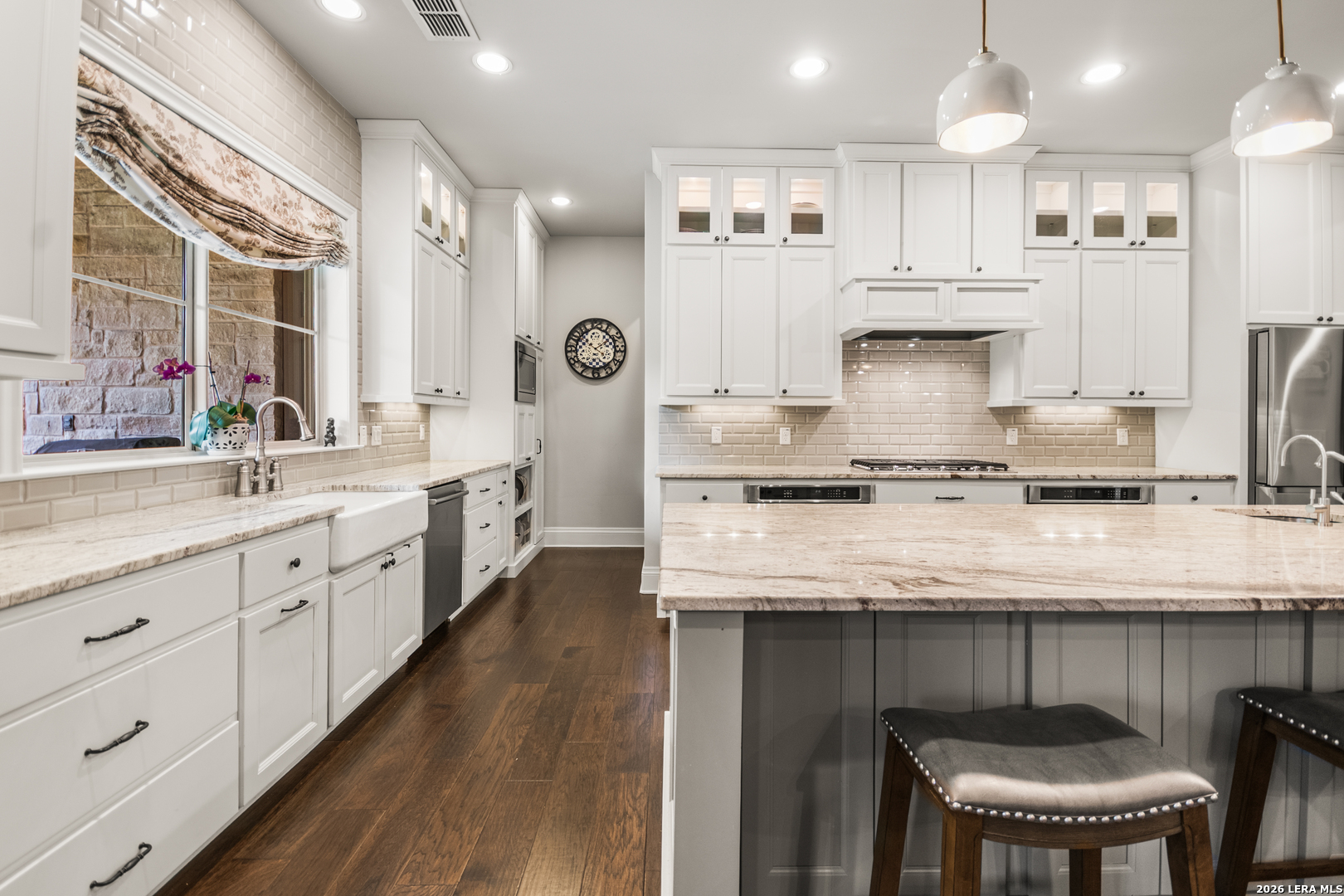 55 Brook Ridge Boerne, TX 78015 - Photo 9 of 59 a kitchen with stainless steel appliances granite countertop a table chairs sink and cabinets