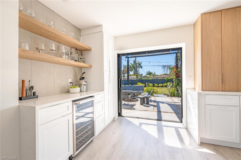 4608 Normandy Drive Naples, FL 34112 - Photo 14 of 49 a kitchen with a sink a counter top space and appliances