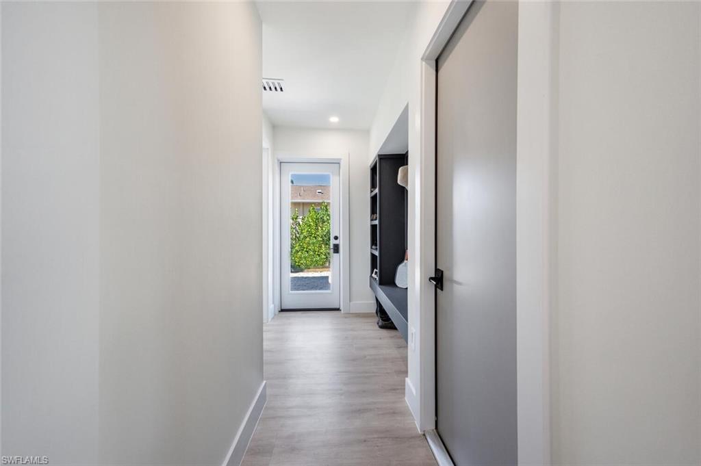4608 Normandy Drive Naples, FL 34112 - Photo 24 of 49 a view of a hallway with a livingroom and a hallway
