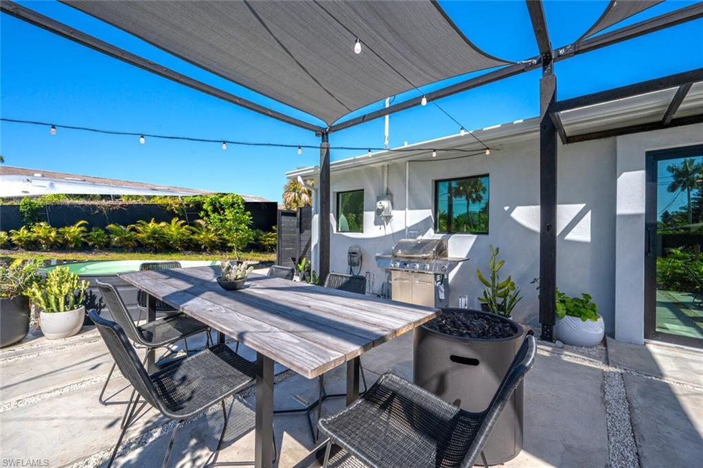 4608 Normandy Drive Naples, FL 34112 - Photo 25 of 49 a view of an outside dining space with a patio