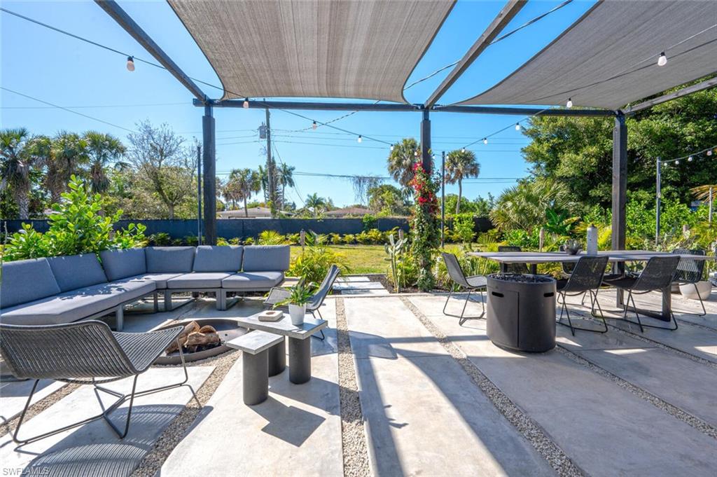 4608 Normandy Drive Naples, FL 34112 - Photo 29 of 49 a living room with patio furniture and a potted plants