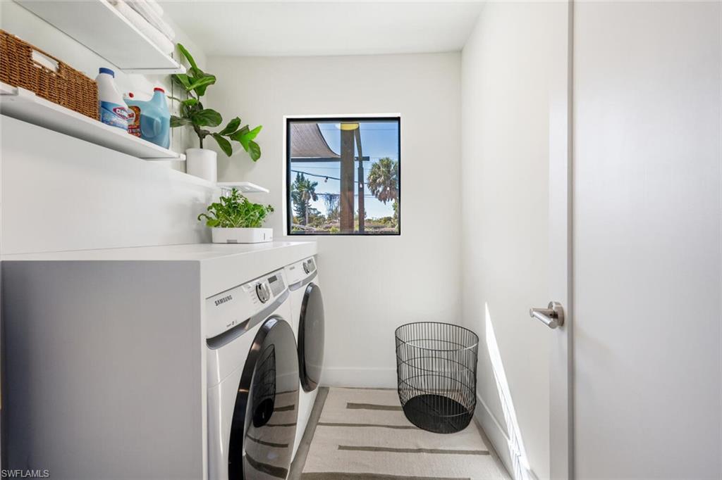 4608 Normandy Drive Naples, FL 34112 - Photo 31 of 49 a view of a hallway with washer and dryer