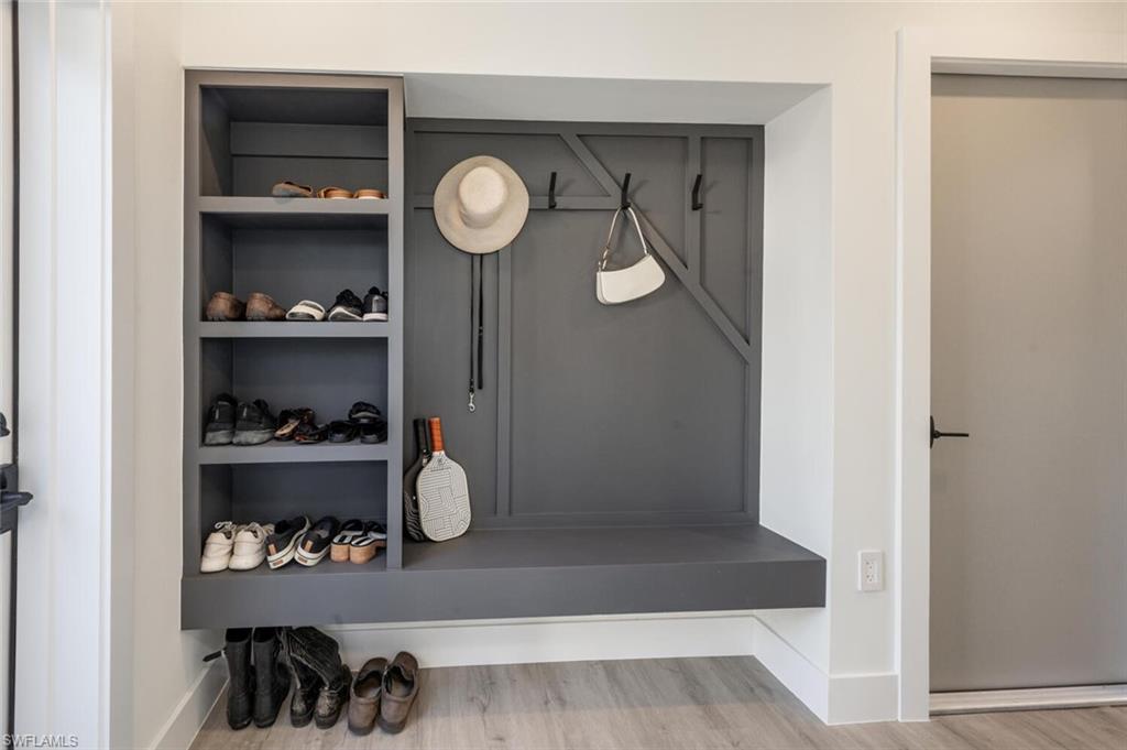 4608 Normandy Drive Naples, FL 34112 - Photo 32 of 49 a view of a closet with wooden floor