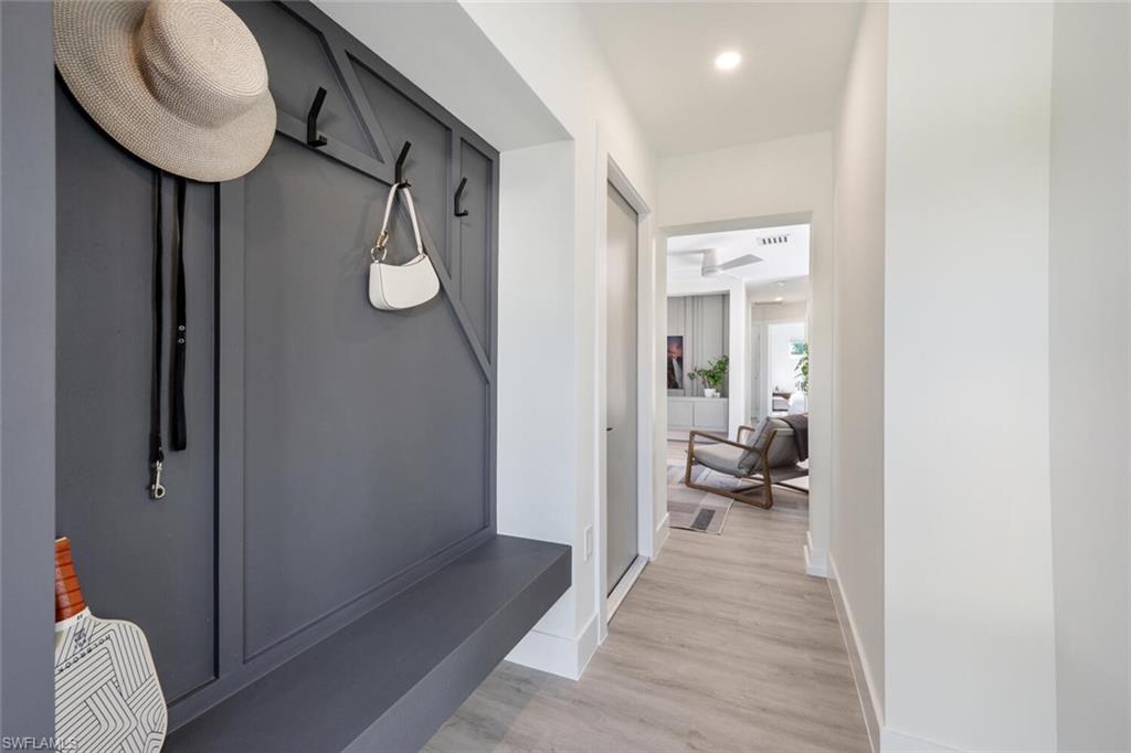 4608 Normandy Drive Naples, FL 34112 - Photo 33 of 49 a very nice looking room with a wooden floor