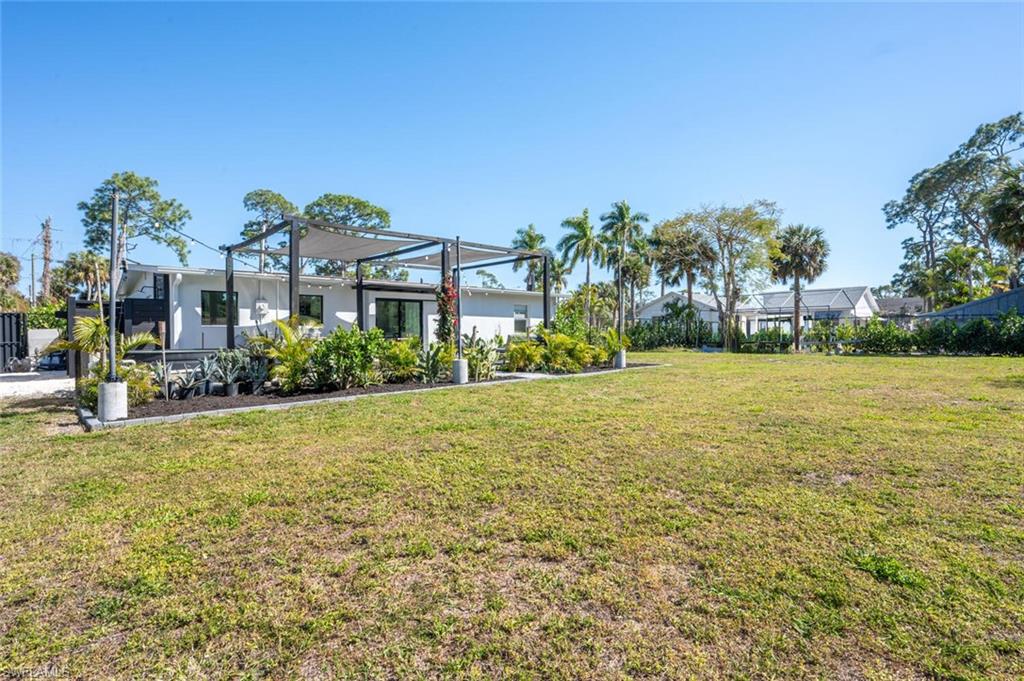 4608 Normandy Drive Naples, FL 34112 - Photo 38 of 49 a house with garden area