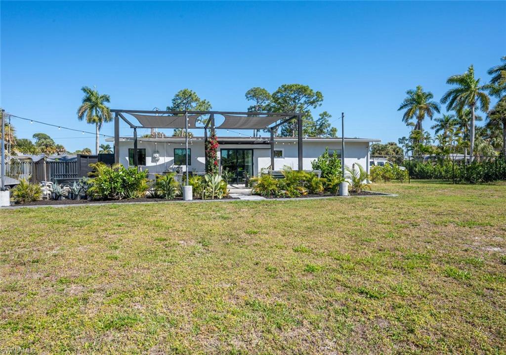 4608 Normandy Drive Naples, FL 34112 - Photo 39 of 49 a front view of a house with a garden