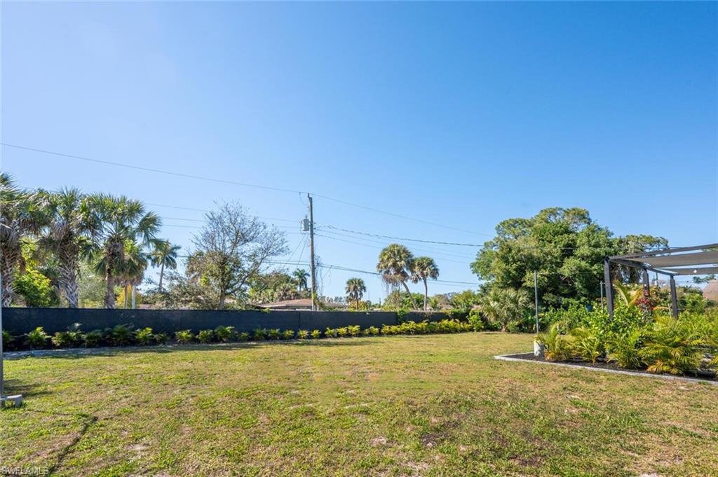4608 Normandy Drive Naples, FL 34112 - Photo 41 of 49 a front view of a house with a yard